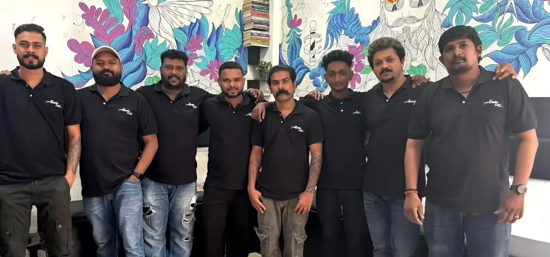 The Gents Camp barbers outside the shop in Vattiyoorkavu